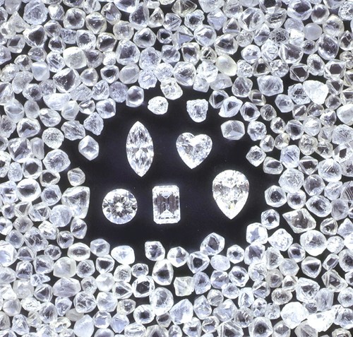 Cut diamonds surrounded by uncut diamonds